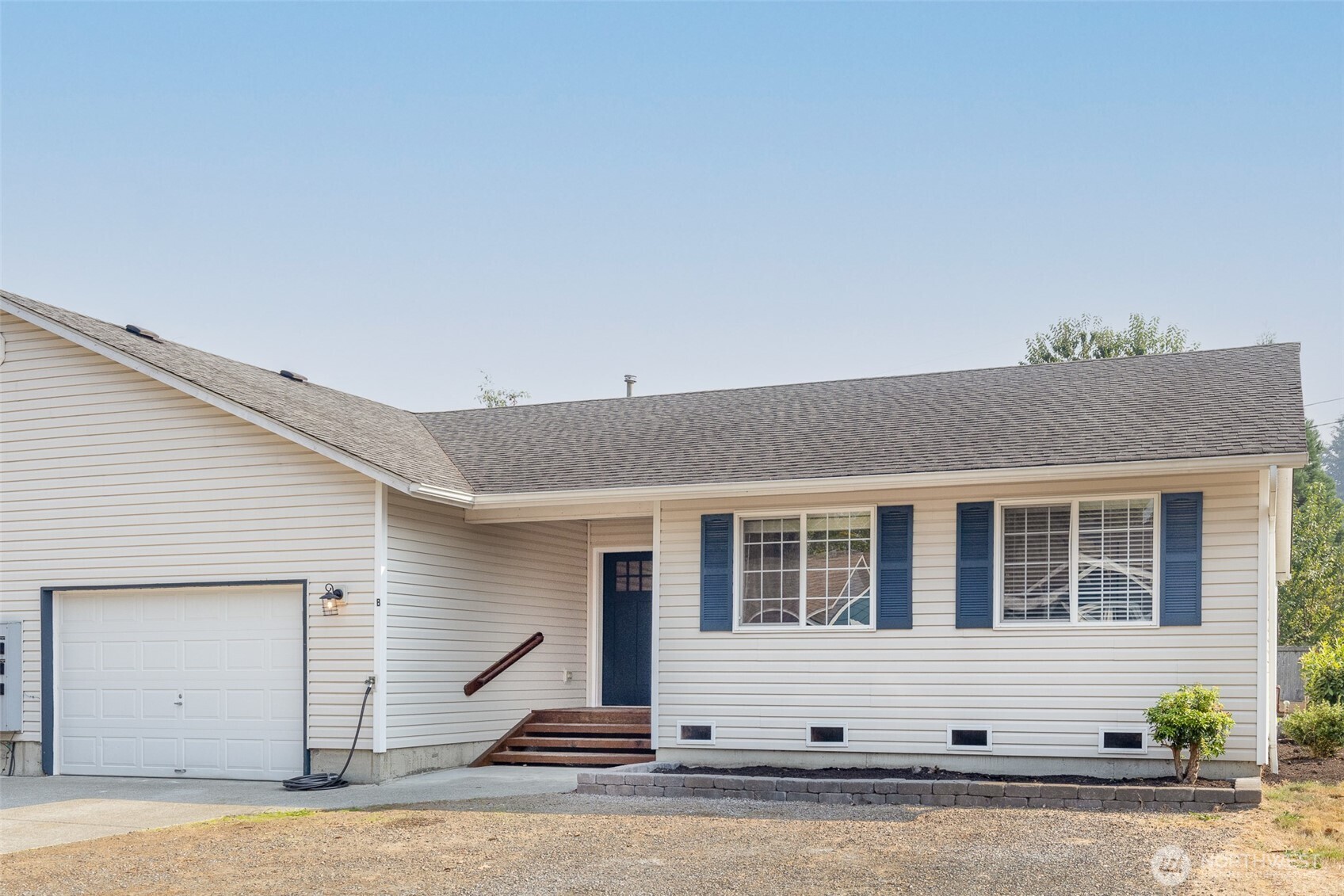 105 May Creek Road Gold Bar, WA 98251 - Photo 18 of 38 a front view of a house with a garage
