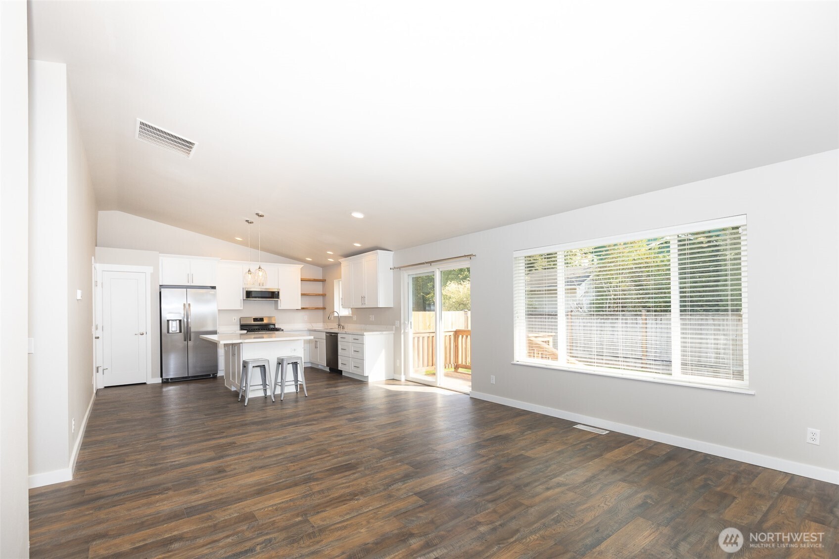 105 May Creek Road Gold Bar, WA 98251 - Photo 24 of 38 a view of a dining room with furniture and wooden floor