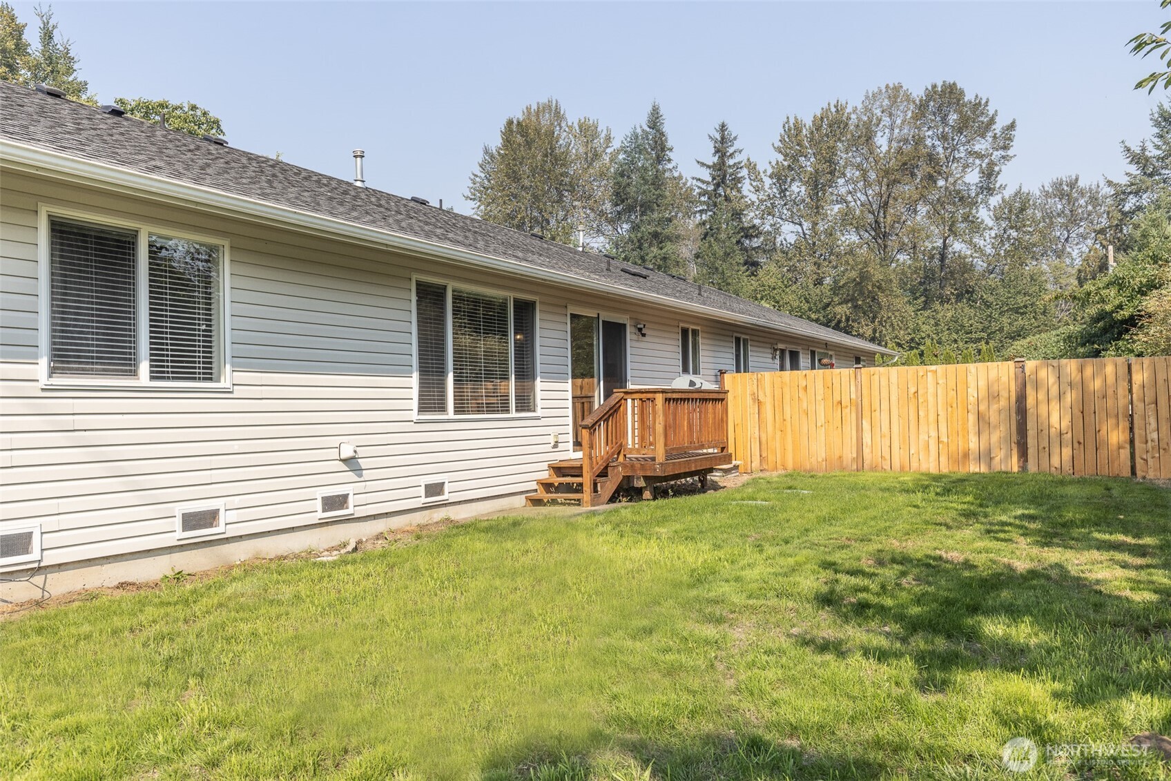 105 May Creek Road Gold Bar, WA 98251 - Photo 32 of 38 a view of a house with backyard and trees