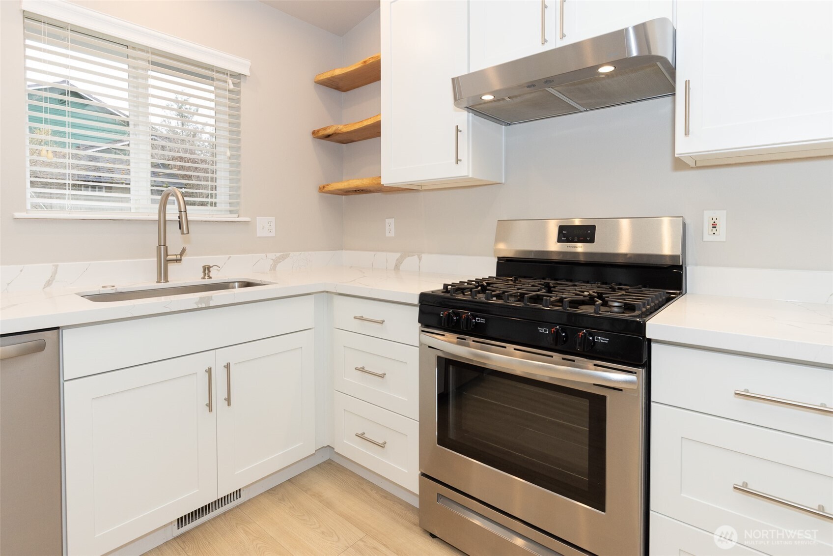 105 May Creek Road Gold Bar, WA 98251 - Photo 8 of 38 a kitchen with granite countertop white cabinets and white appliances
