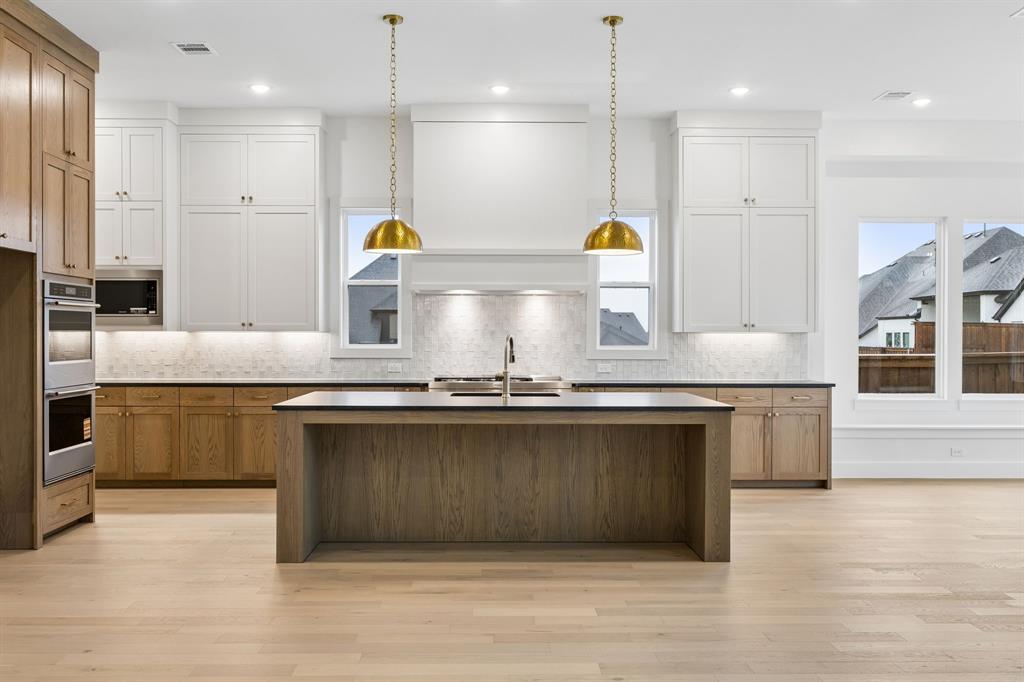 1120 Whirlabout Road Prosper, TX 75078 - Photo 7 of 25 Bold and beautiful, the dream kitchen in our Hayden plan is all that you have dreamed of and more!
