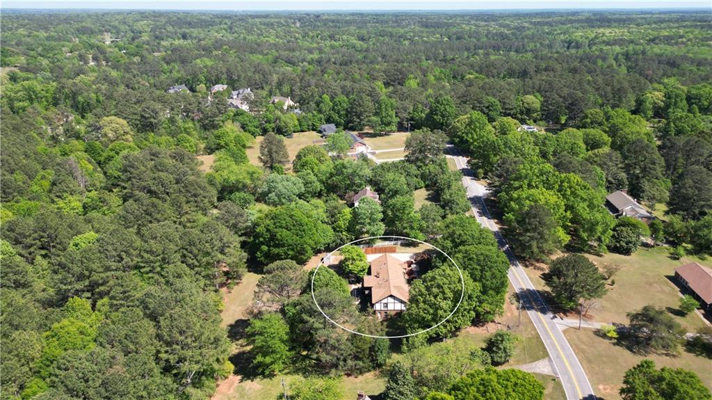 130 Hawn Road Fayetteville, GA 30215 - Photo 57 of 67 an aerial view of residential house with outdoor space and trees all around