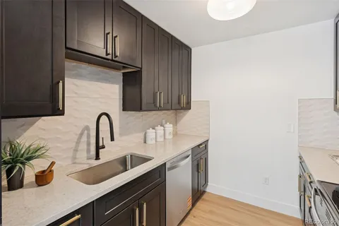 a kitchen with a stove microwave and refrigerator