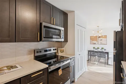 a kitchen with stainless steel appliances a sink and cabinets
