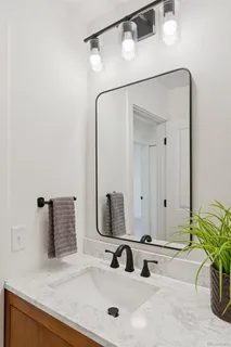 a bathroom with a shower and a sink