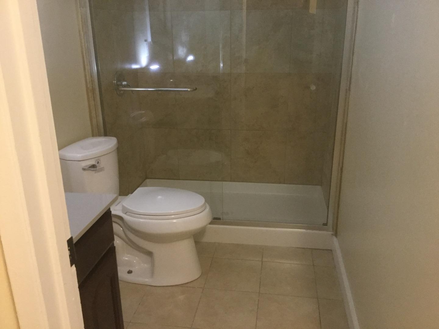 Peralta Street Hayward, CA 94541 - Photo 2 of 17 a bathroom with a toilet and a shower