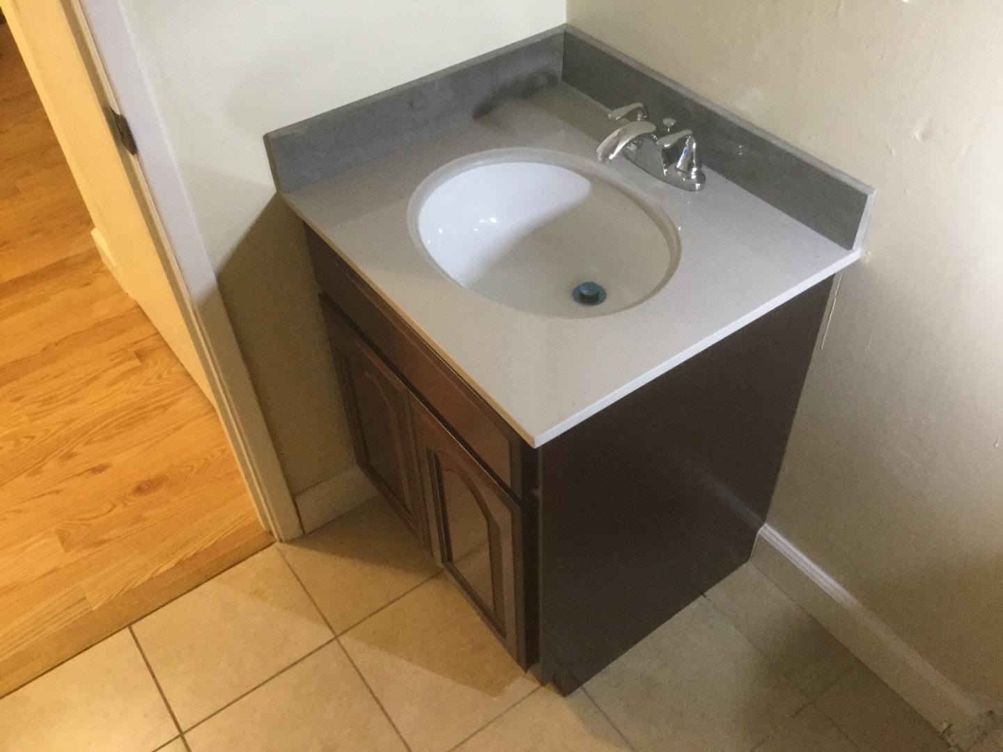 Peralta Street Hayward, CA 94541 - Photo 4 of 17 a bathroom with a sink and a mirror