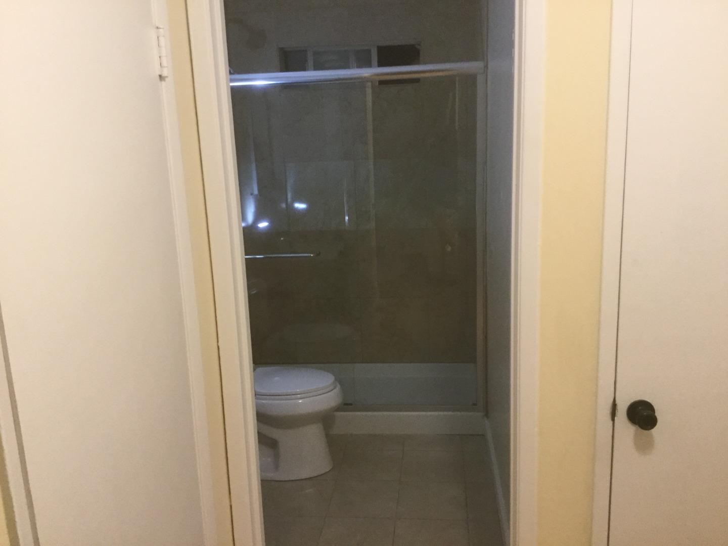 Peralta Street Hayward, CA 94541 - Photo 7 of 17 a bathroom with a shower and a toilet