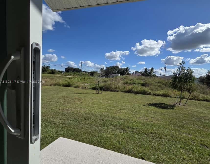 3403 34th Street Southwest, Unit 3403 Lehigh Acres, FL 33976 - Photo 14 of 16 a view of a outdoor space