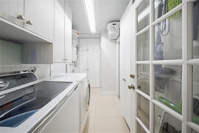 a kitchen with a sink and a refrigerator