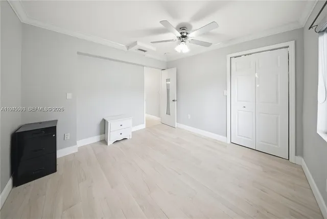 a view of an empty room with a fireplace
