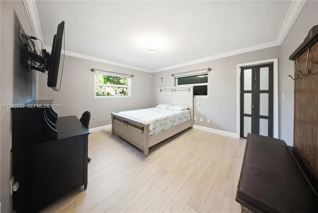 a bathroom with a granite countertop sink a toilet a mirror and shower