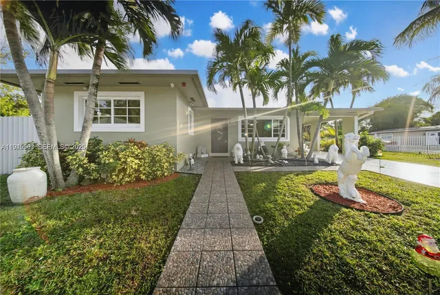 a view of a backyard of the house