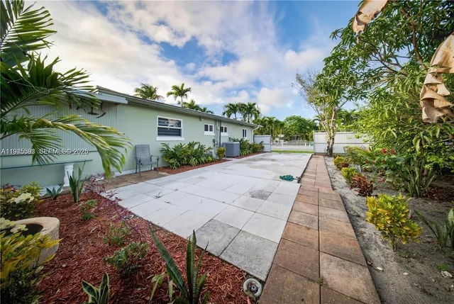 a view of a street with a building in the background