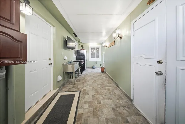 a view of a house with a garden and swimming pool