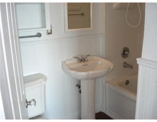 a bathroom with a sink and mirror