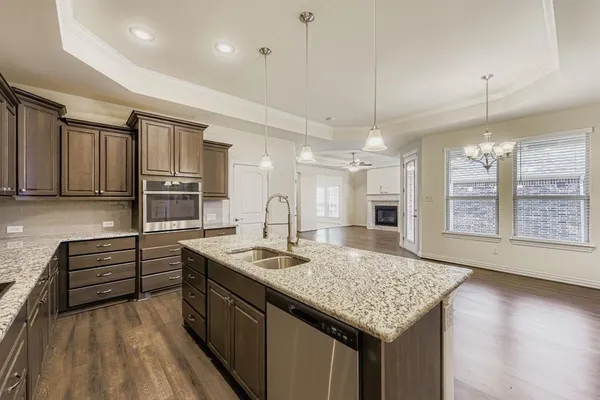 a kitchen with sink and center island
