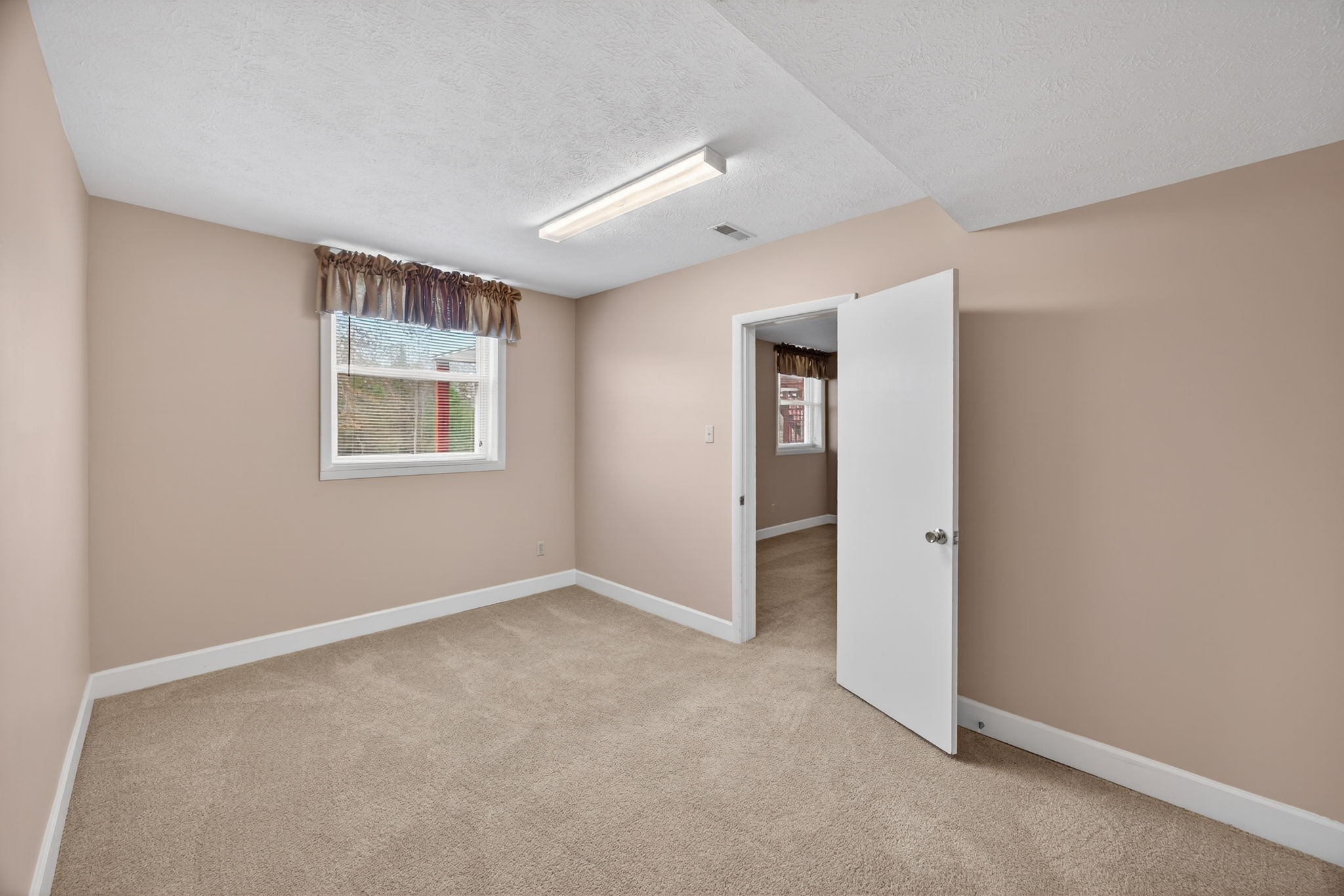 165 Almyra Road Sparta, TN 38583 - Photo 36 of 49 an empty room with windows and closet