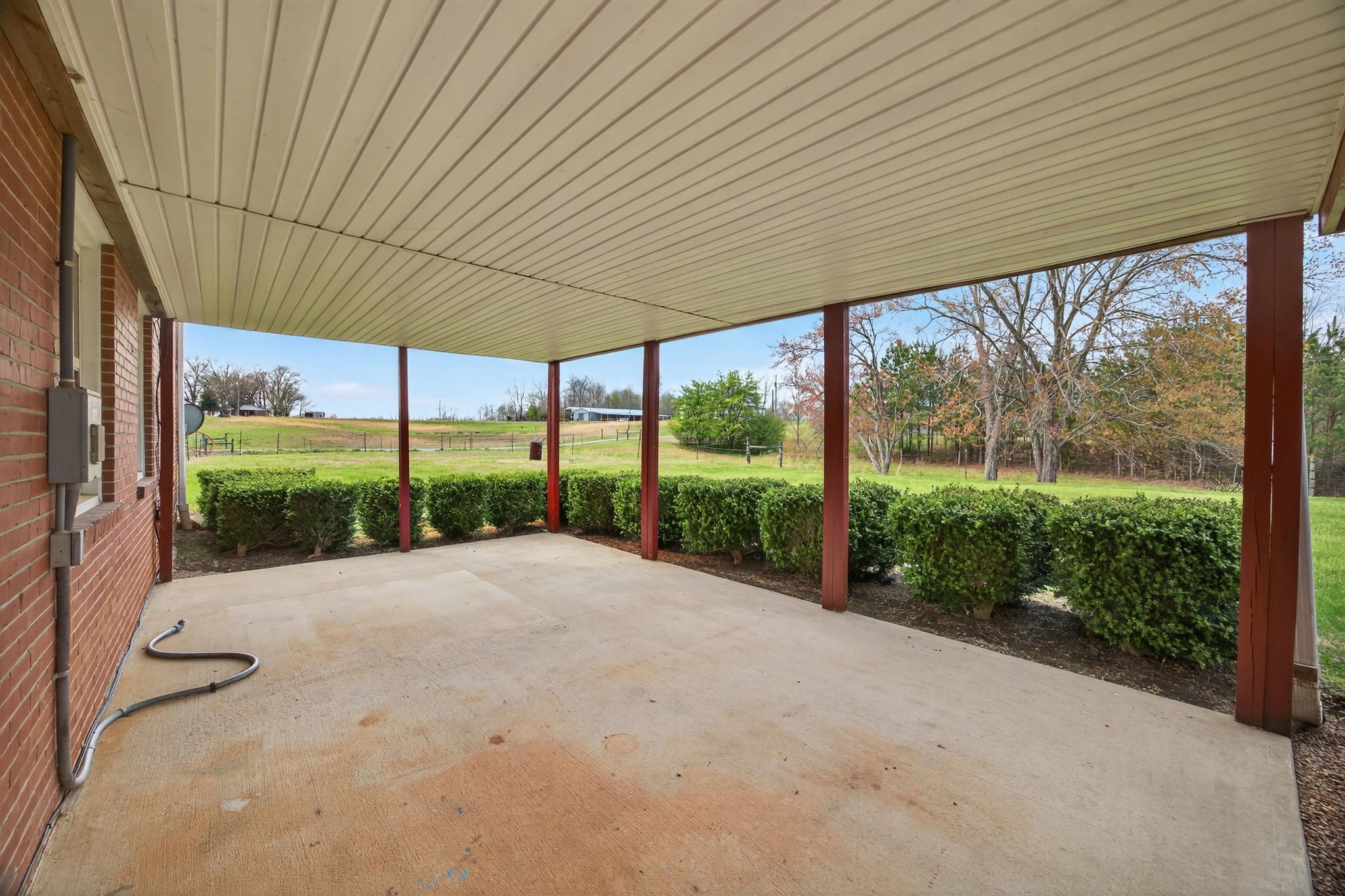 165 Almyra Road Sparta, TN 38583 - Photo 37 of 49 a view of a house with a big yard potted plants and large tree