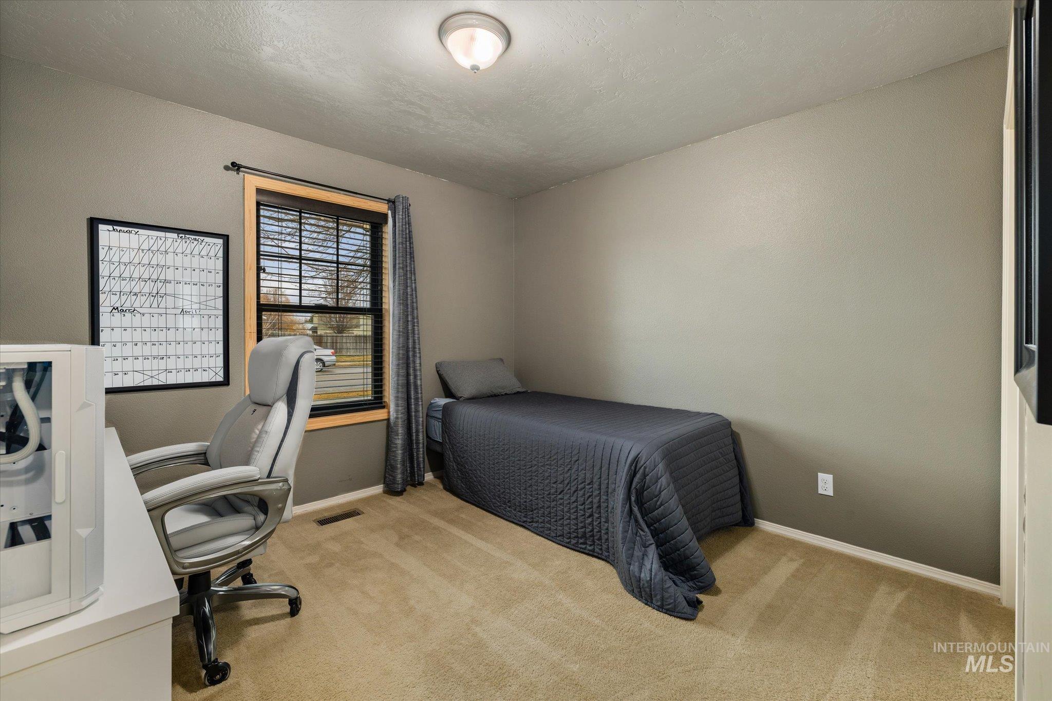 7166 Yellow Fern Road Nampa, ID 83687 - Photo 23 of 35 Bedroom with an office area and light colored carpet