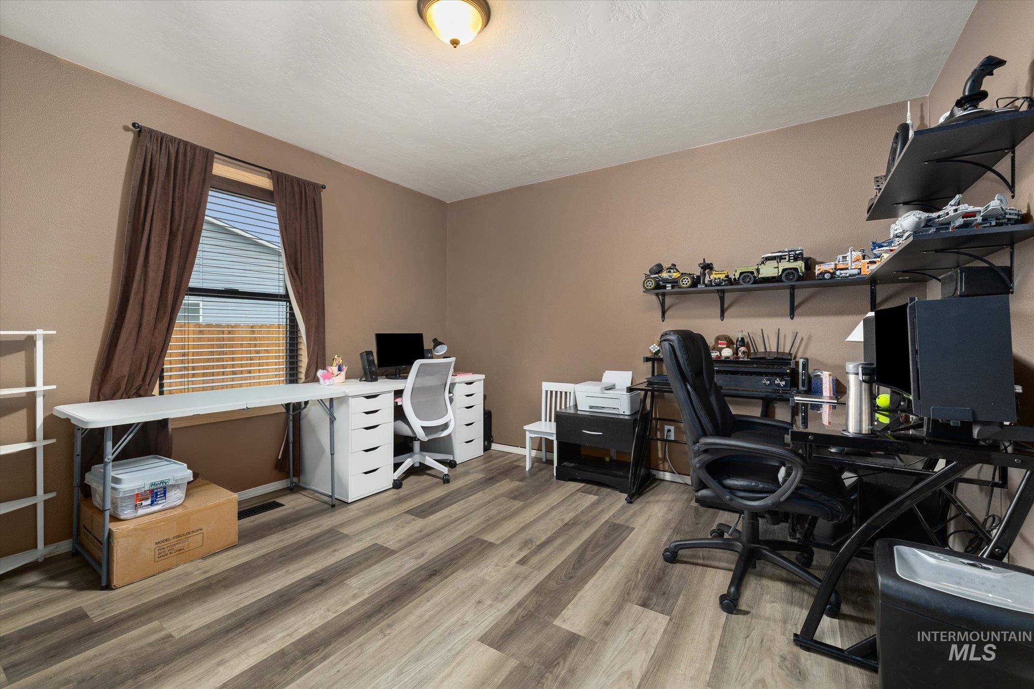7166 Yellow Fern Road Nampa, ID 83687 - Photo 26 of 35 Office area with light wood-style flooring and baseboards