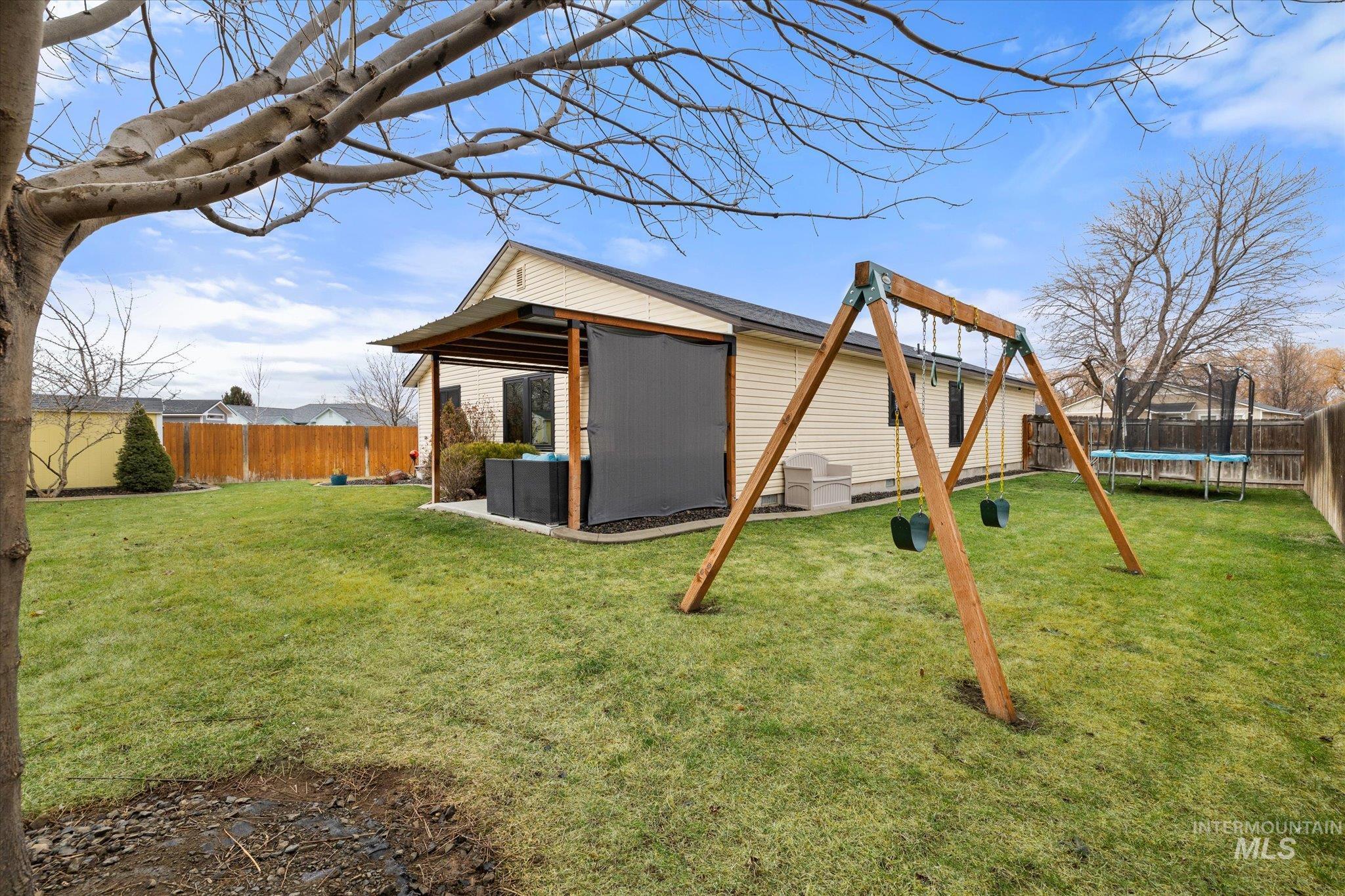 7166 Yellow Fern Road Nampa, ID 83687 - Photo 31 of 35 Fenced backyard with a trampoline