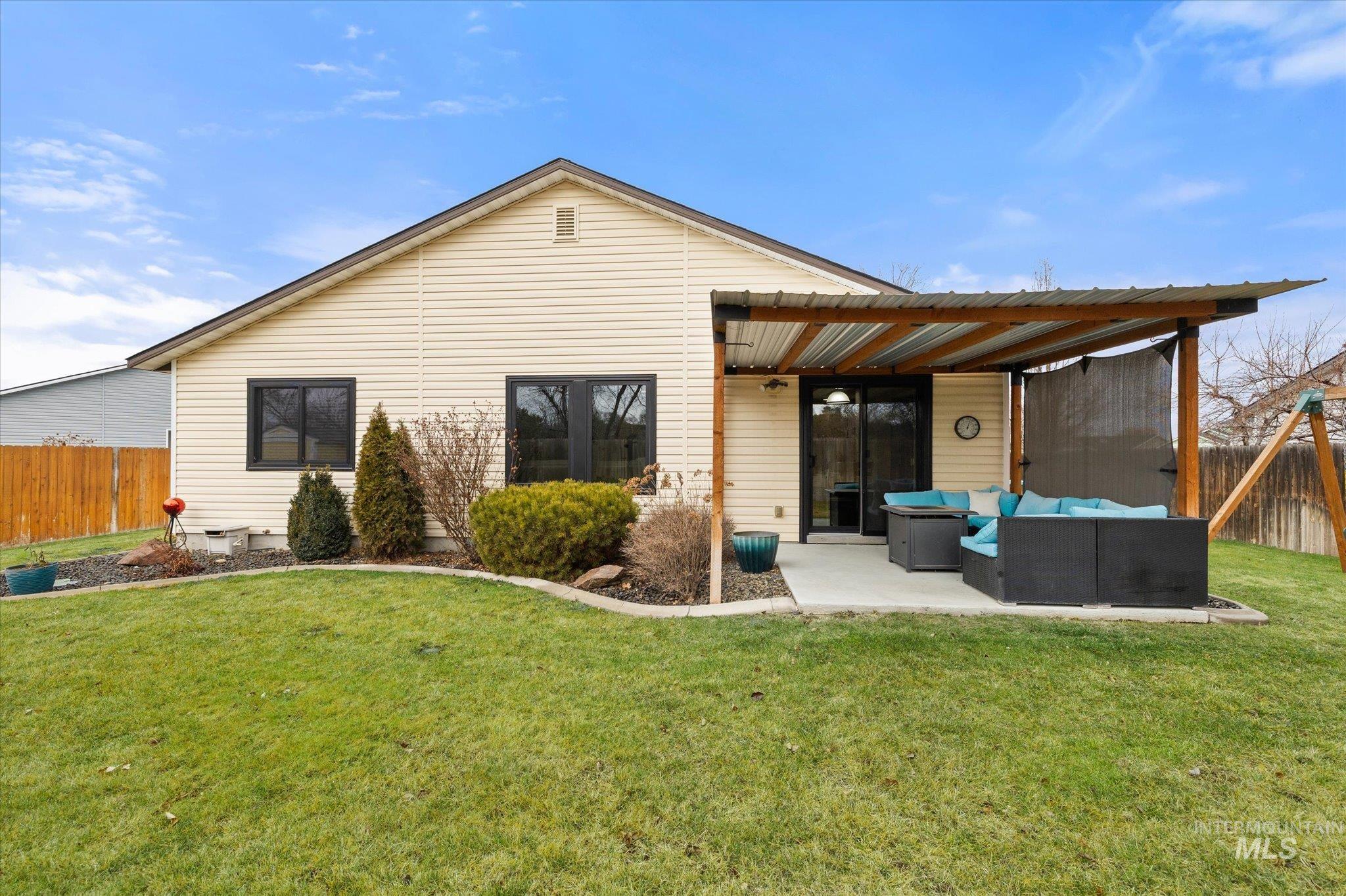 7166 Yellow Fern Road Nampa, ID 83687 - Photo 32 of 35 Rear view of house featuring outdoor lounge area