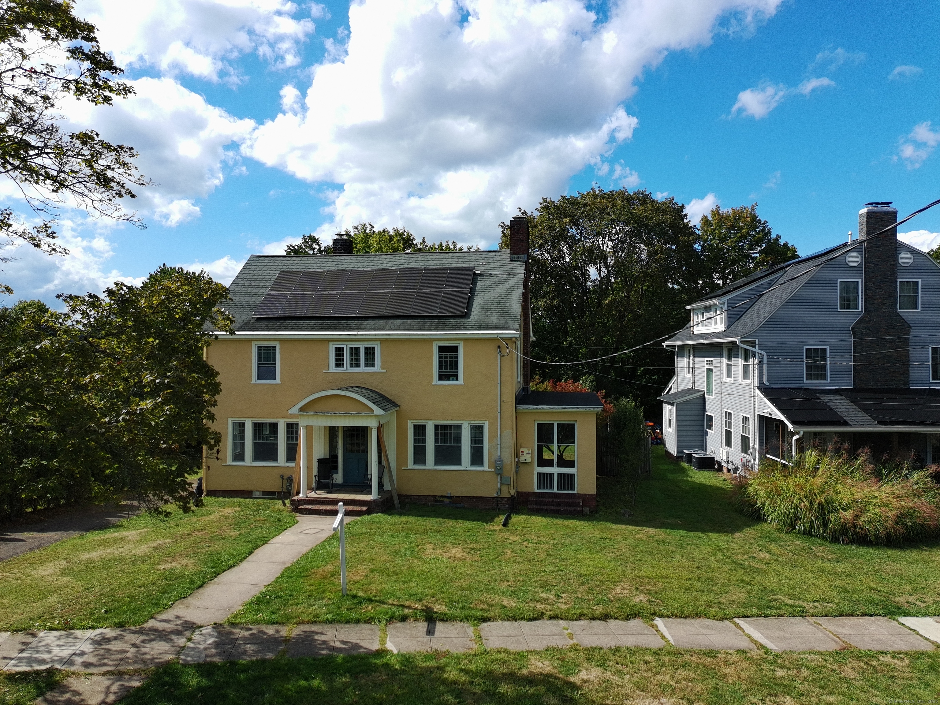 a aerial view of a house with a yard
