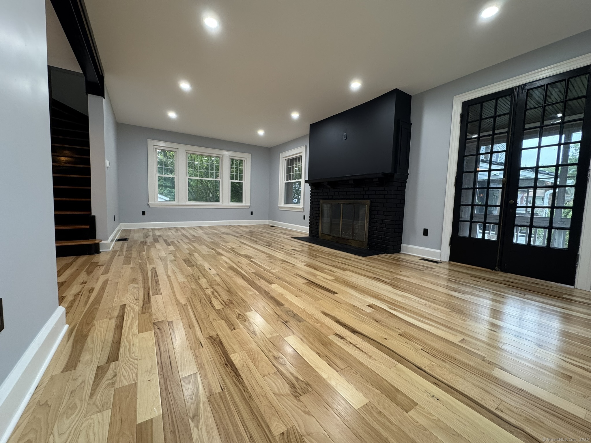 127 Lambert Avenue Meriden, CT 06451 - Photo 12 of 37 a view of empty room with wooden floor and windows
