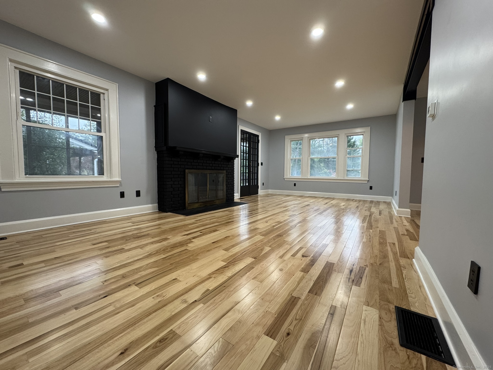 127 Lambert Avenue Meriden, CT 06451 - Photo 13 of 37 a view of empty room with wooden floor and fan
