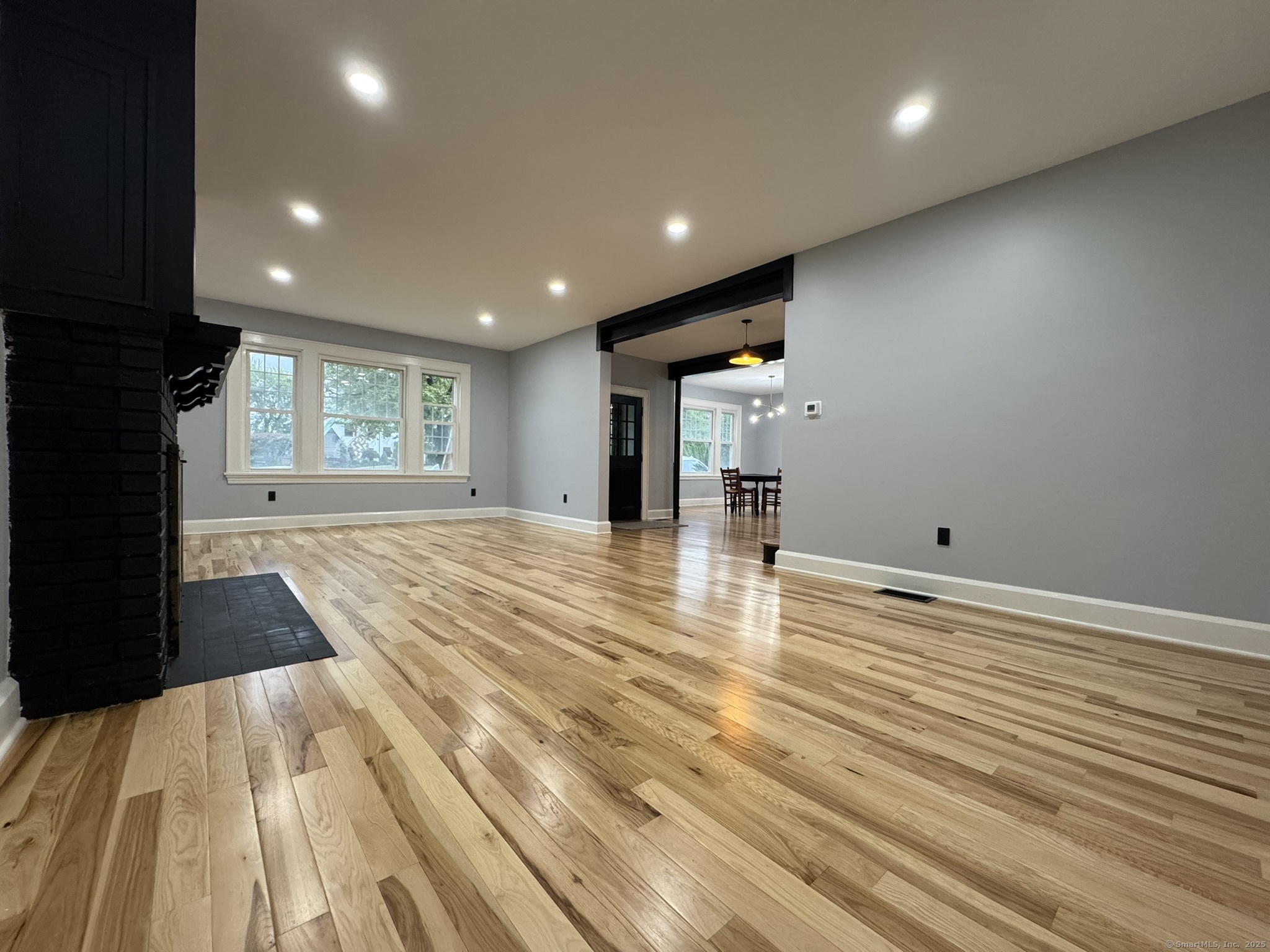 127 Lambert Avenue Meriden, CT 06451 - Photo 14 of 37 a view of empty room with wooden floor and fan