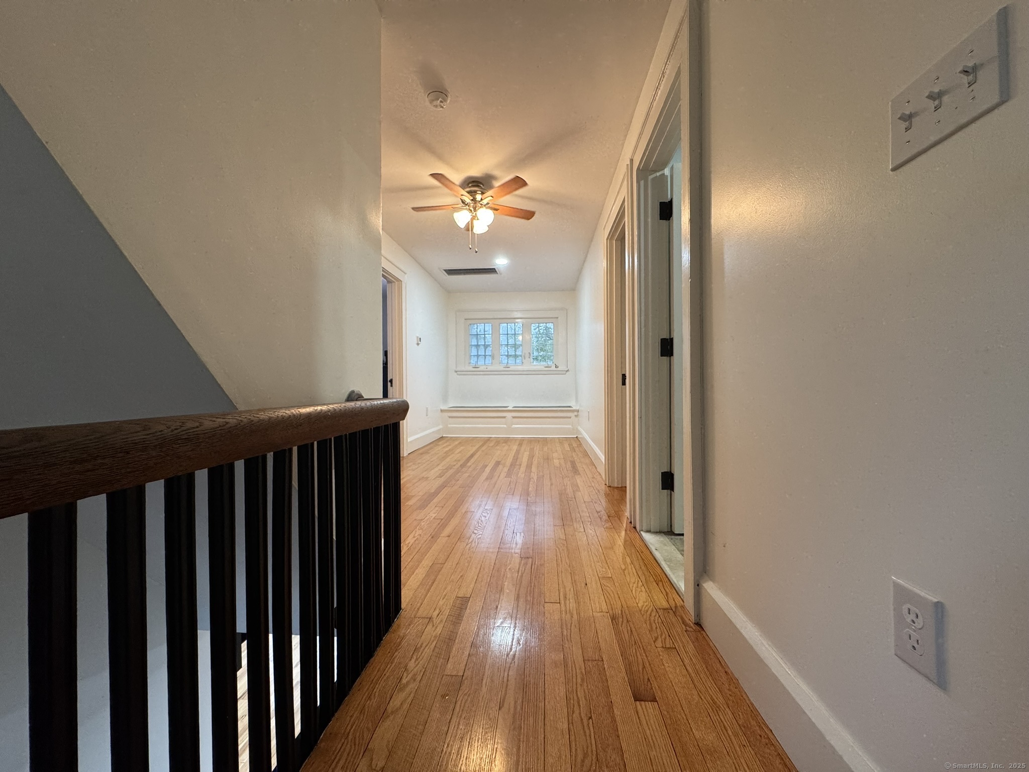 127 Lambert Avenue Meriden, CT 06451 - Photo 15 of 37 a view of a hallway with wooden floor and staircase
