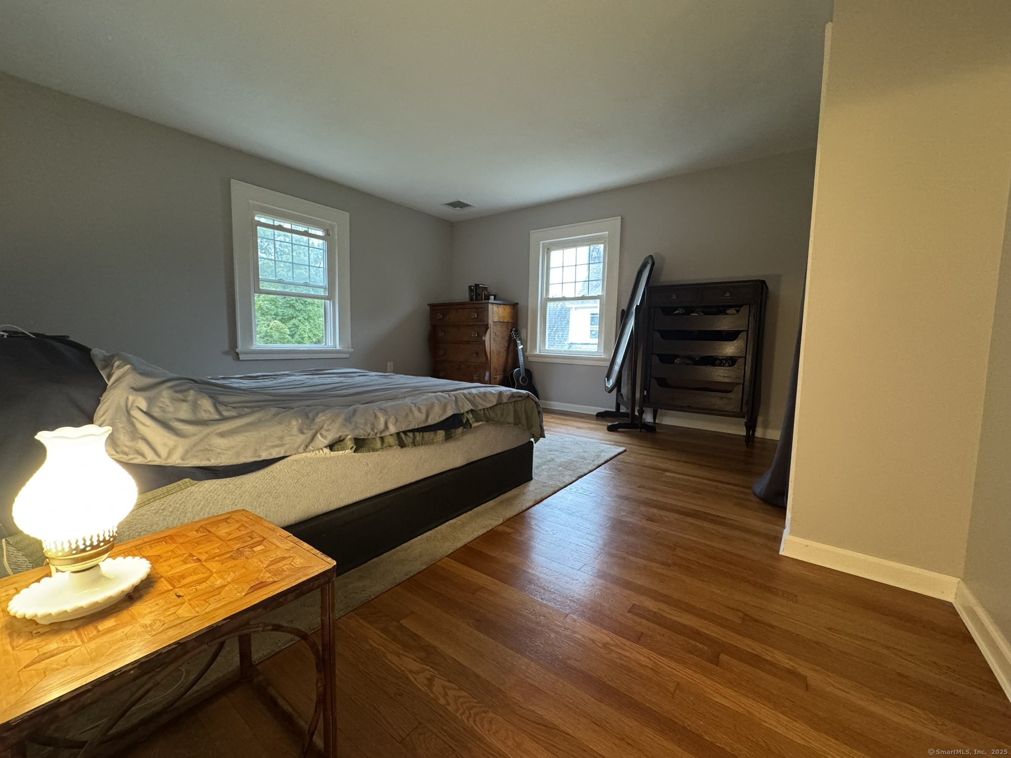 127 Lambert Avenue Meriden, CT 06451 - Photo 17 of 37 a bedroom with a bed and wooden floor