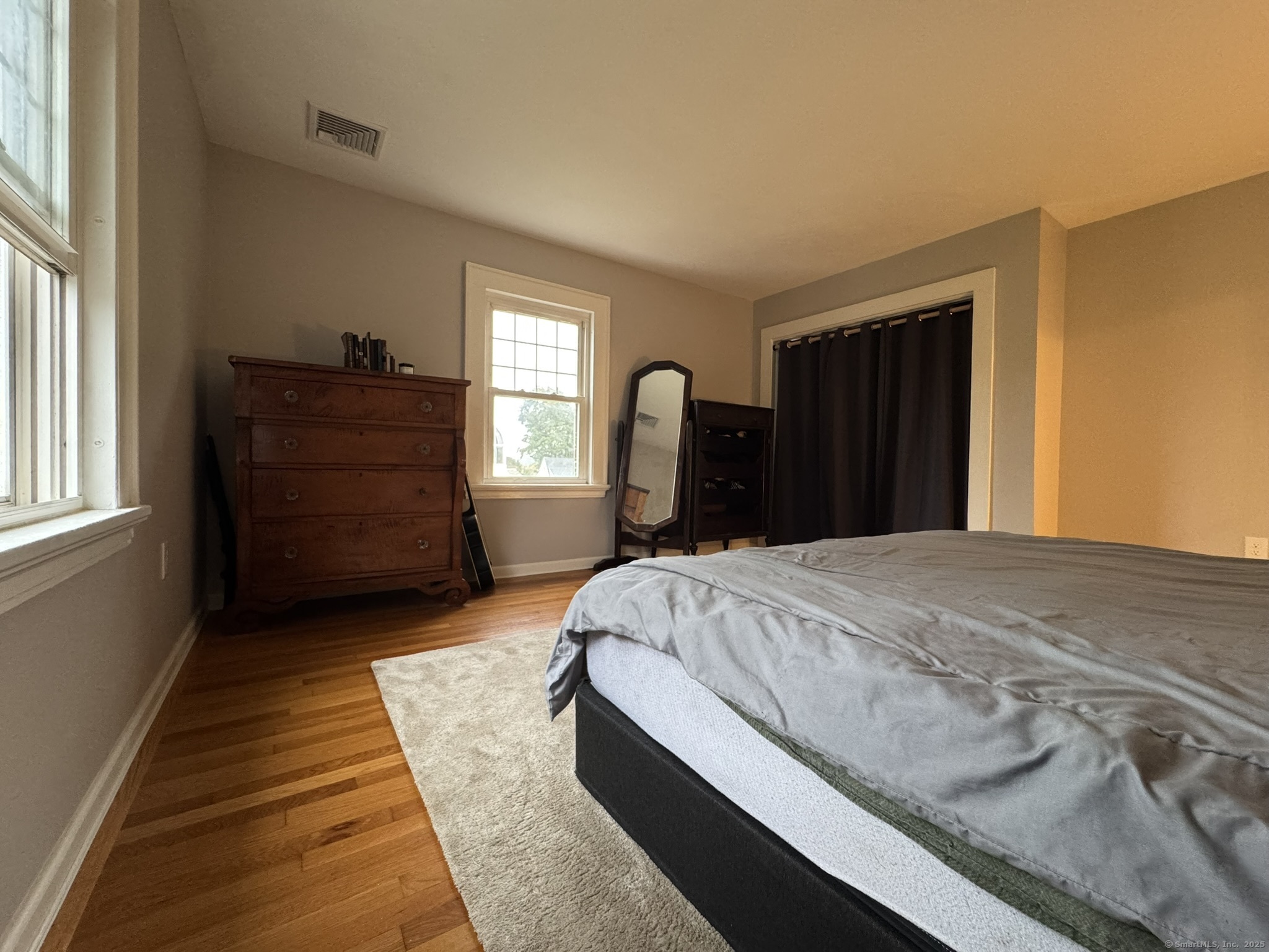 127 Lambert Avenue Meriden, CT 06451 - Photo 18 of 37 a bed sitting in a bedroom next to a window and dresser