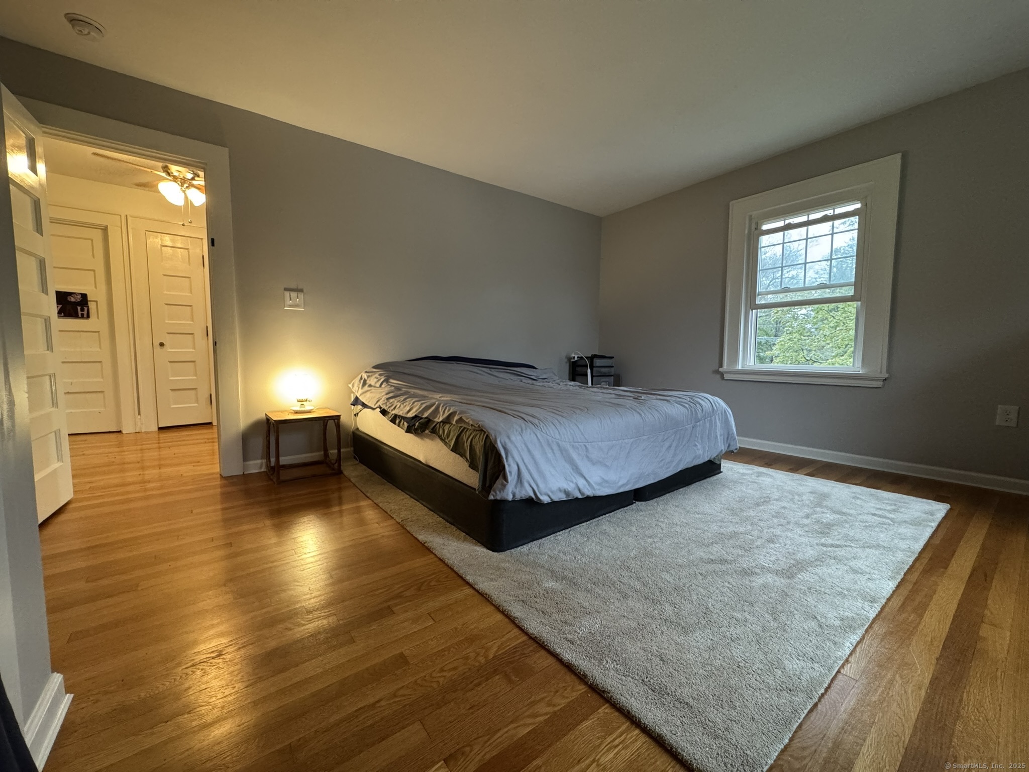 127 Lambert Avenue Meriden, CT 06451 - Photo 20 of 37 a spacious bedroom with a bed and wooden floor