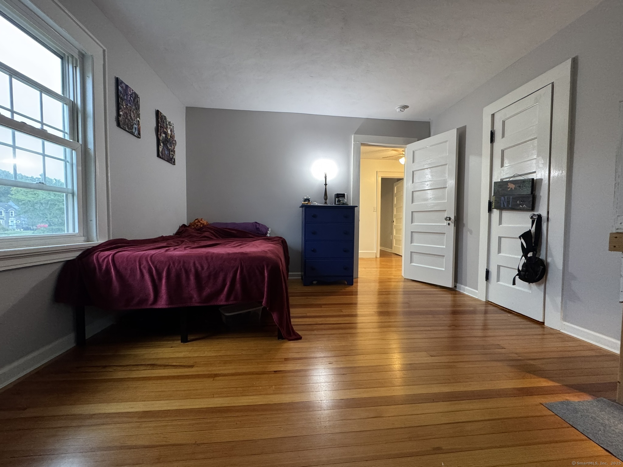 127 Lambert Avenue Meriden, CT 06451 - Photo 22 of 37 a spacious bedroom with a bed closet and a large window