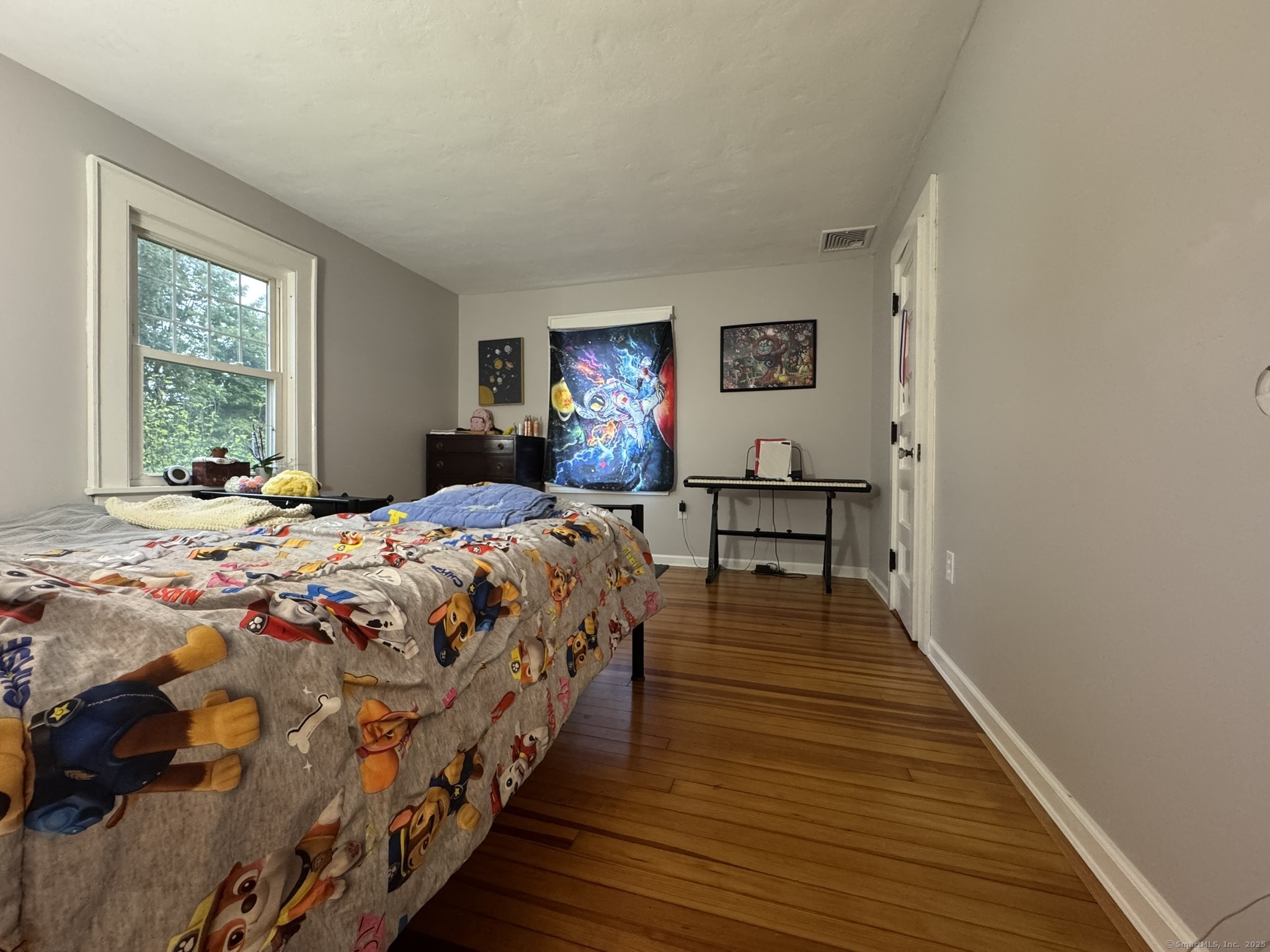 127 Lambert Avenue Meriden, CT 06451 - Photo 23 of 37 a bedroom with a bed and wooden floor