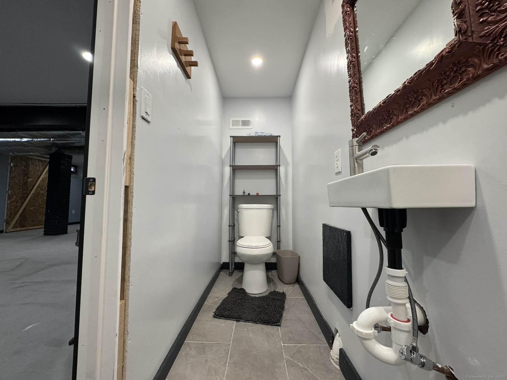 127 Lambert Avenue Meriden, CT 06451 - Photo 29 of 37 a bathroom with a toilet and a shower