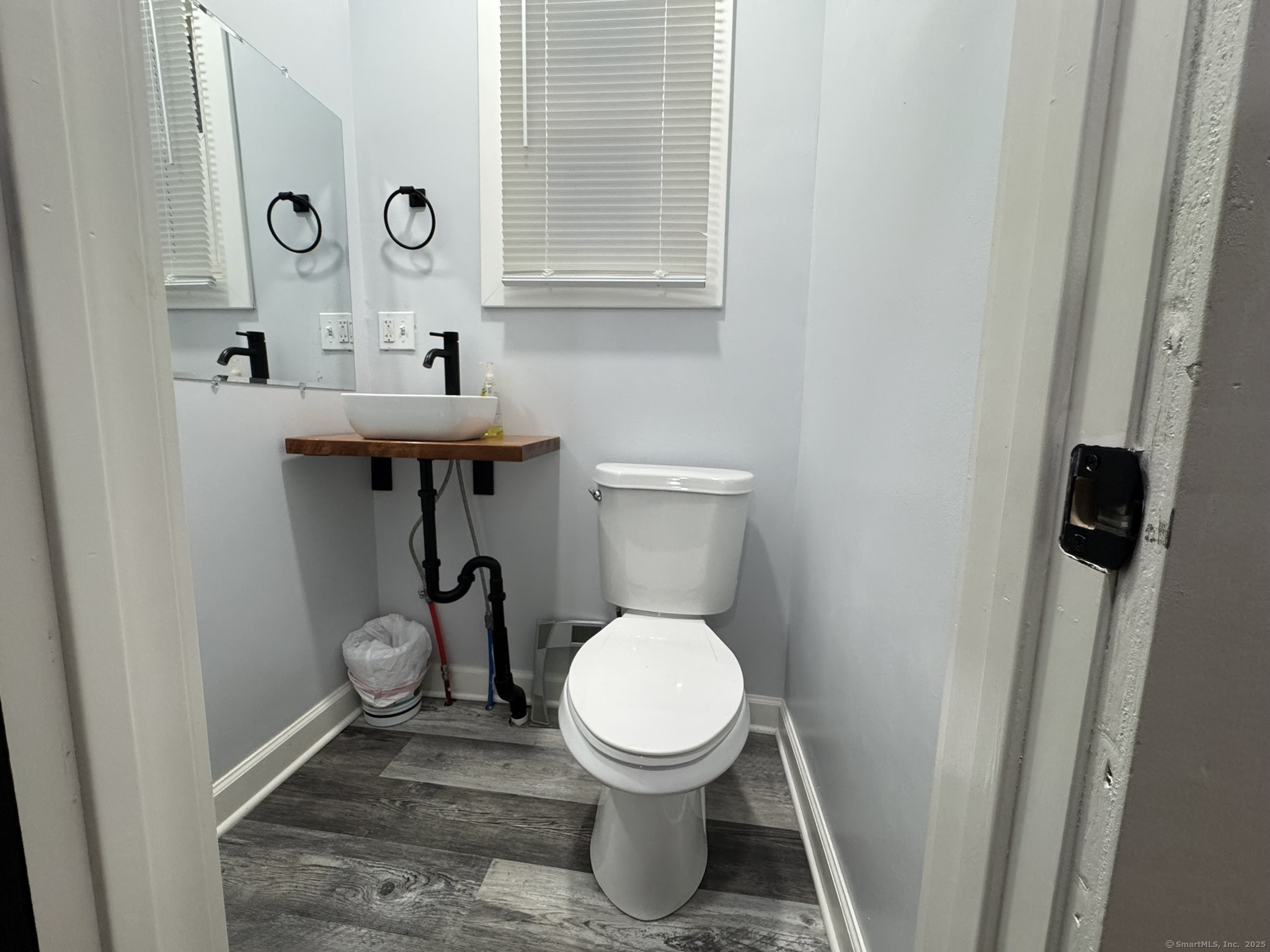 127 Lambert Avenue Meriden, CT 06451 - Photo 31 of 37 a bathroom with a toilet and a sink