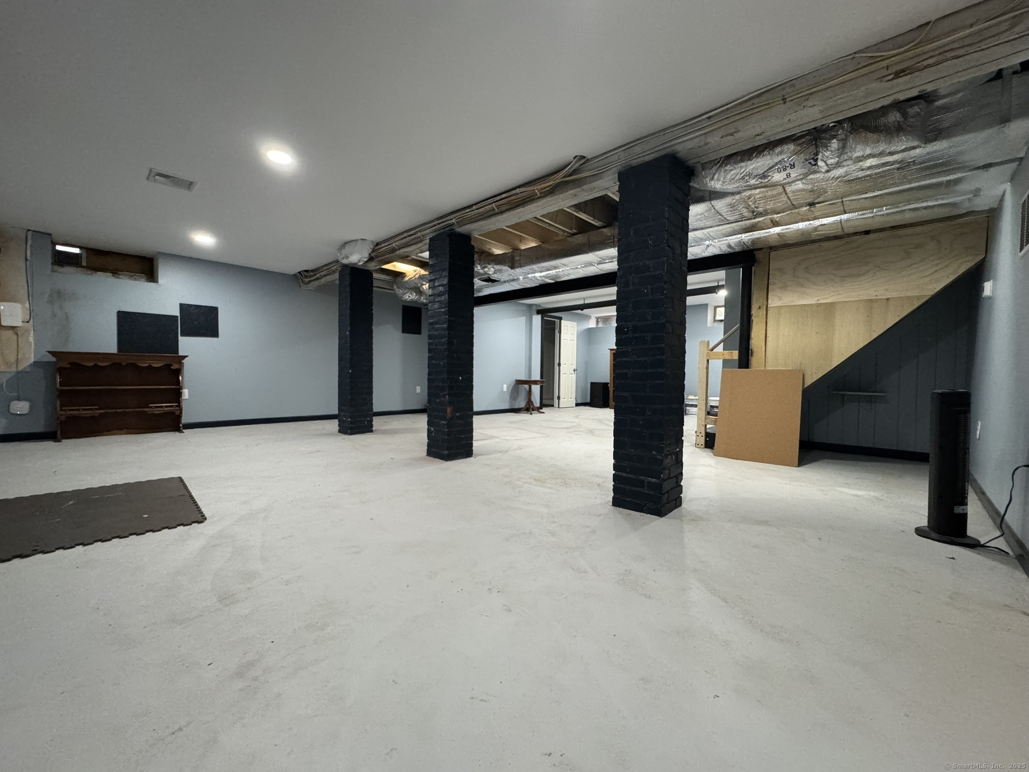 127 Lambert Avenue Meriden, CT 06451 - Photo 34 of 37 a view of an empty room with furniture and a ceiling fan
