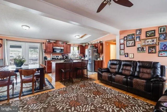 a living room with furniture window and wooden floor