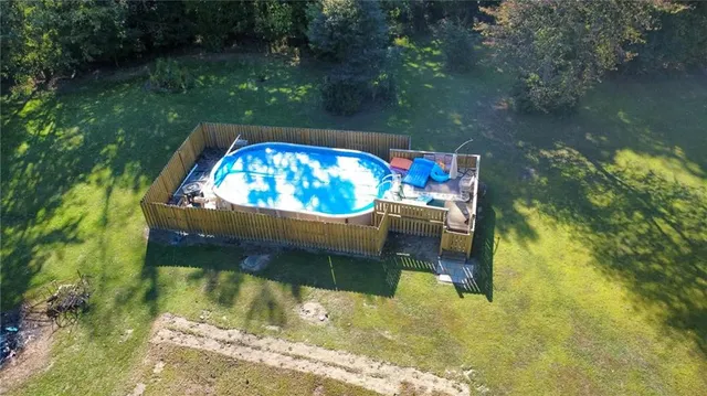 a view of swimming pool from a lake view