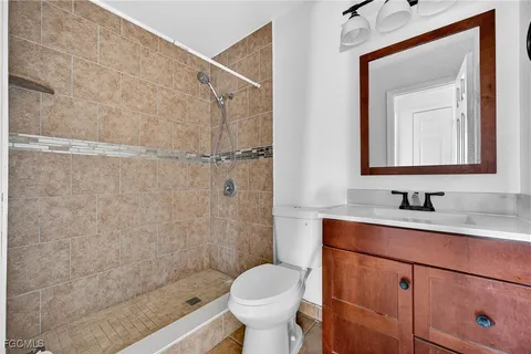 a view of a porch with a floor to ceiling window and an entryway