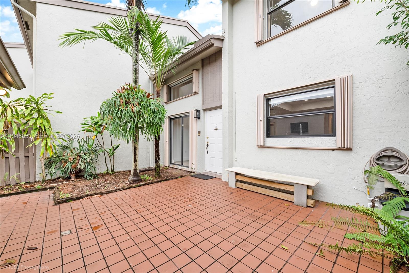 11416 Southwest 110th Lane Miami, FL 33176 - Photo 2 of 25 a house with trees in front of it