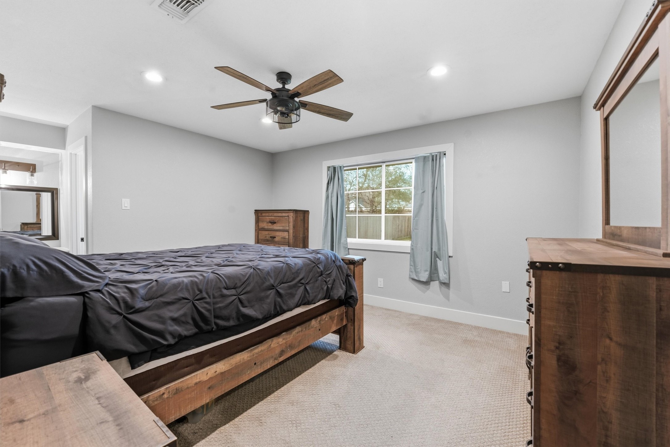 431 Dover Lane Spring, TX 77373 - Photo 11 of 19 a bedroom with a large bed and window