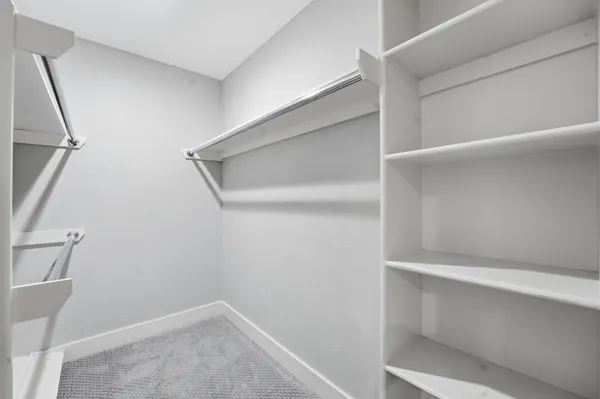 a view of an empty walk in closet