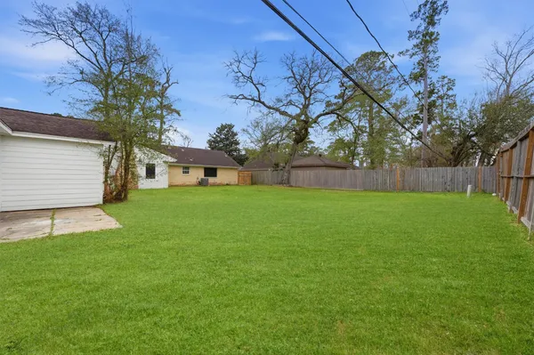 a view of a backyard with a small cabin