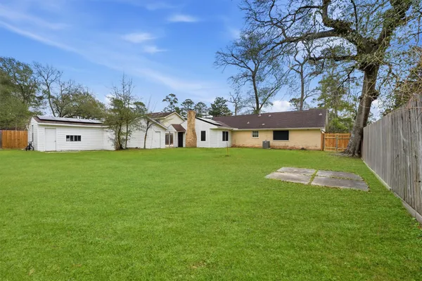 a view of a house with a big yard