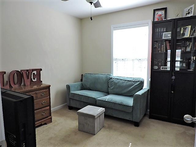 2701 Hidden Ridge Court Clarksville, TN 37043 - Photo 13 of 25 a living room with furniture a bookshelf and a window