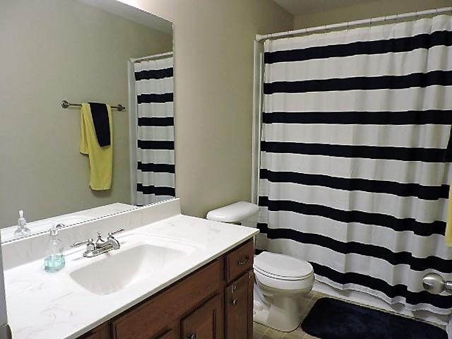 2701 Hidden Ridge Court Clarksville, TN 37043 - Photo 14 of 25 a bathroom with a sink a toilet a shower and a mirror
